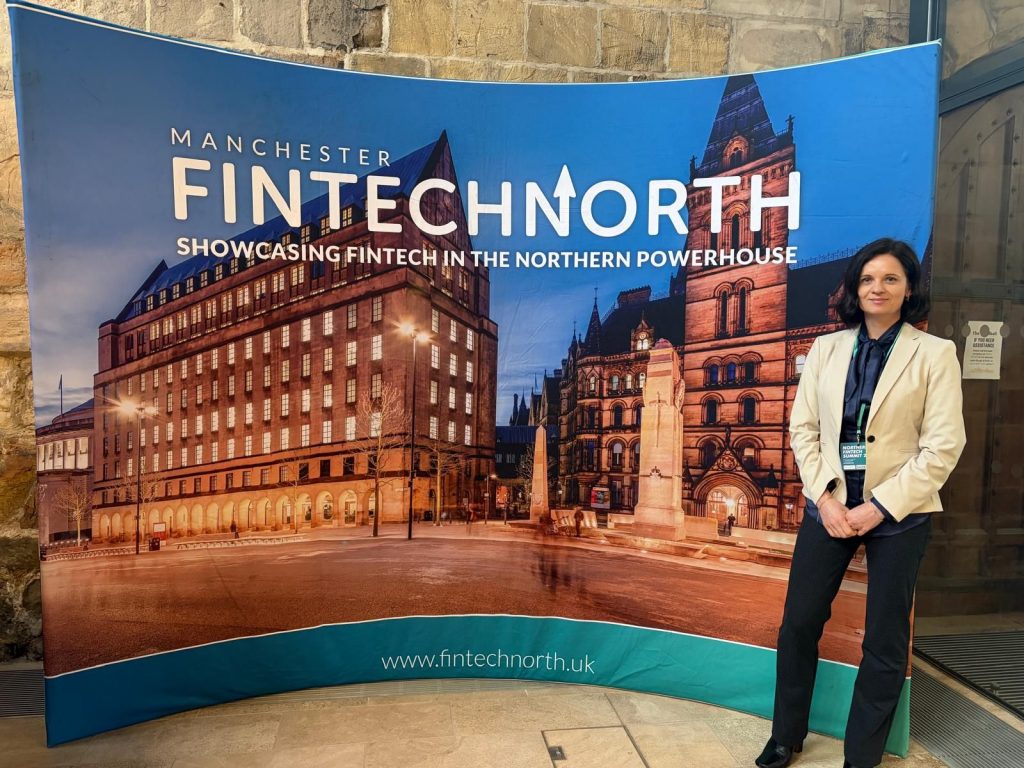 Lorita Cornish infront of a fintech north poster