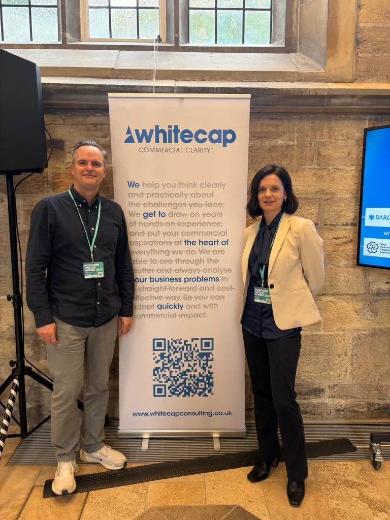 Jullian Wells and Lorita Cornish infront of a whitecap roll up banner