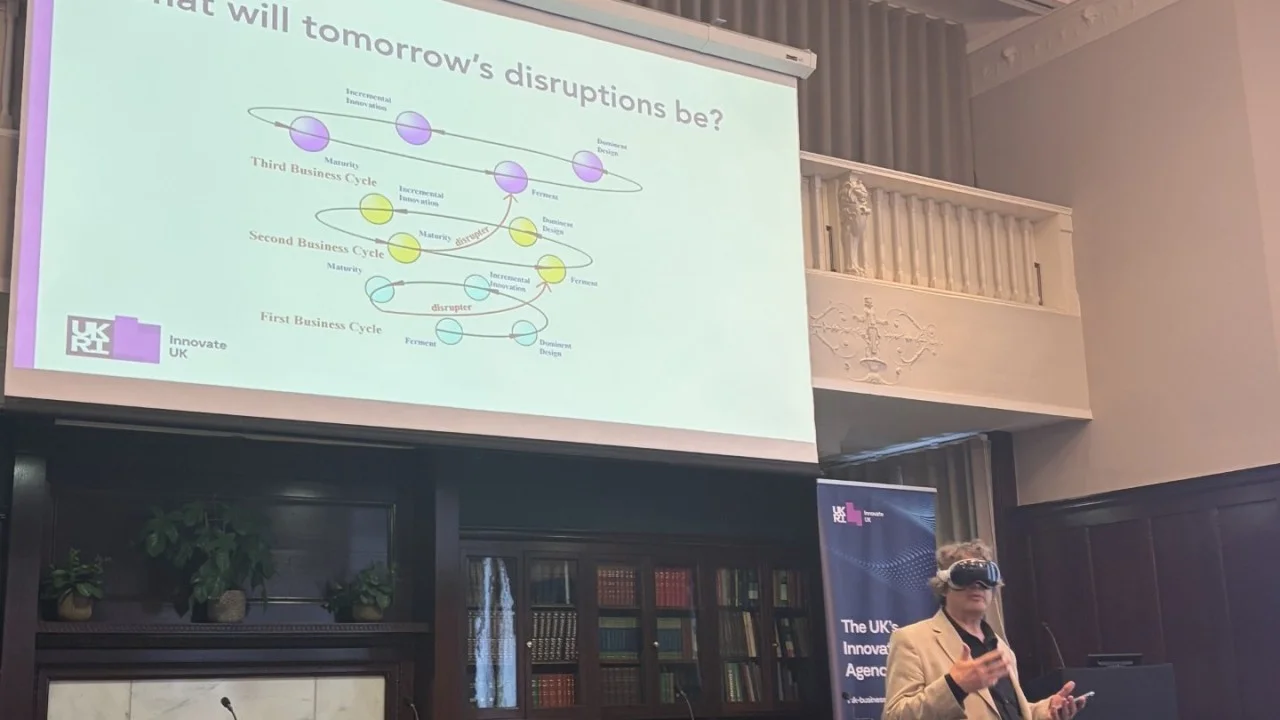 tommorows disruptions slide with a man speaking wearing virtual reality goggles
